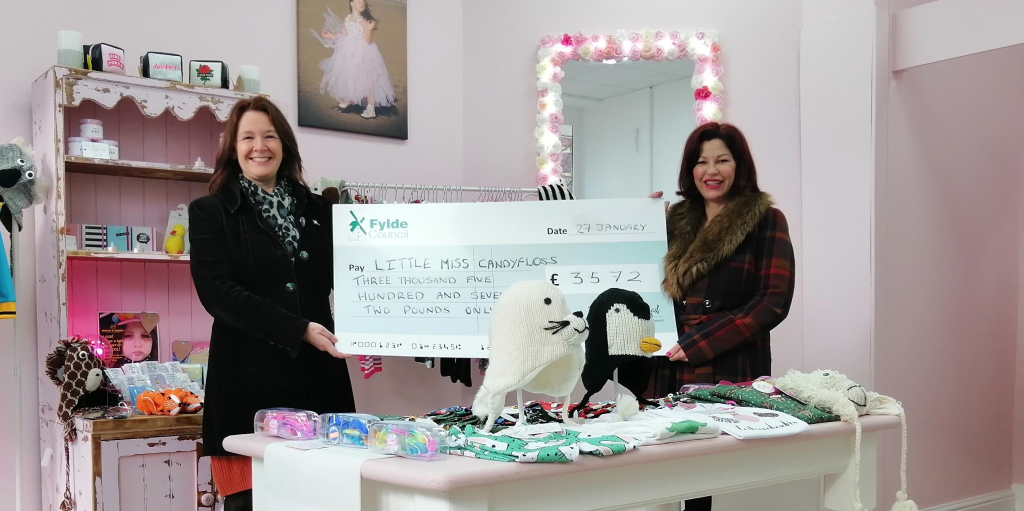 Cllr Karen Buckley, Leader of Fylde, presents a cheque to Shauni Houghton, owner of Little Miss Candyfloss