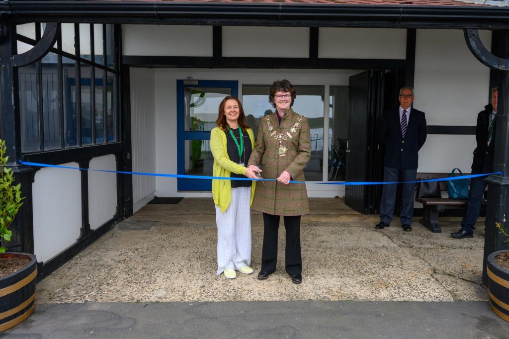 Cllr Karen Buckley [L], Leader of Fylde, and Cllr Elaine Silverwood, Mayor of Fylde, cut the ceremonial ribbon at the celebration of the Fairhaven Restoration Project.